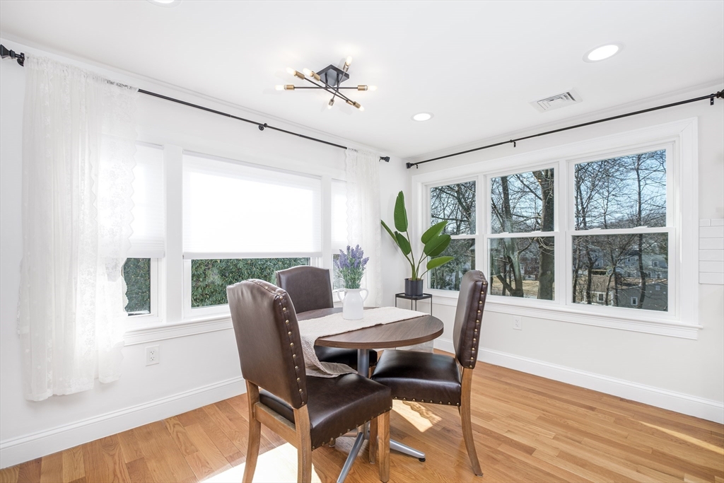 33 Sargent Road Winchester, MA 01890 - Photo 10 of 42 a dining room with furniture a chandelier and wooden floor