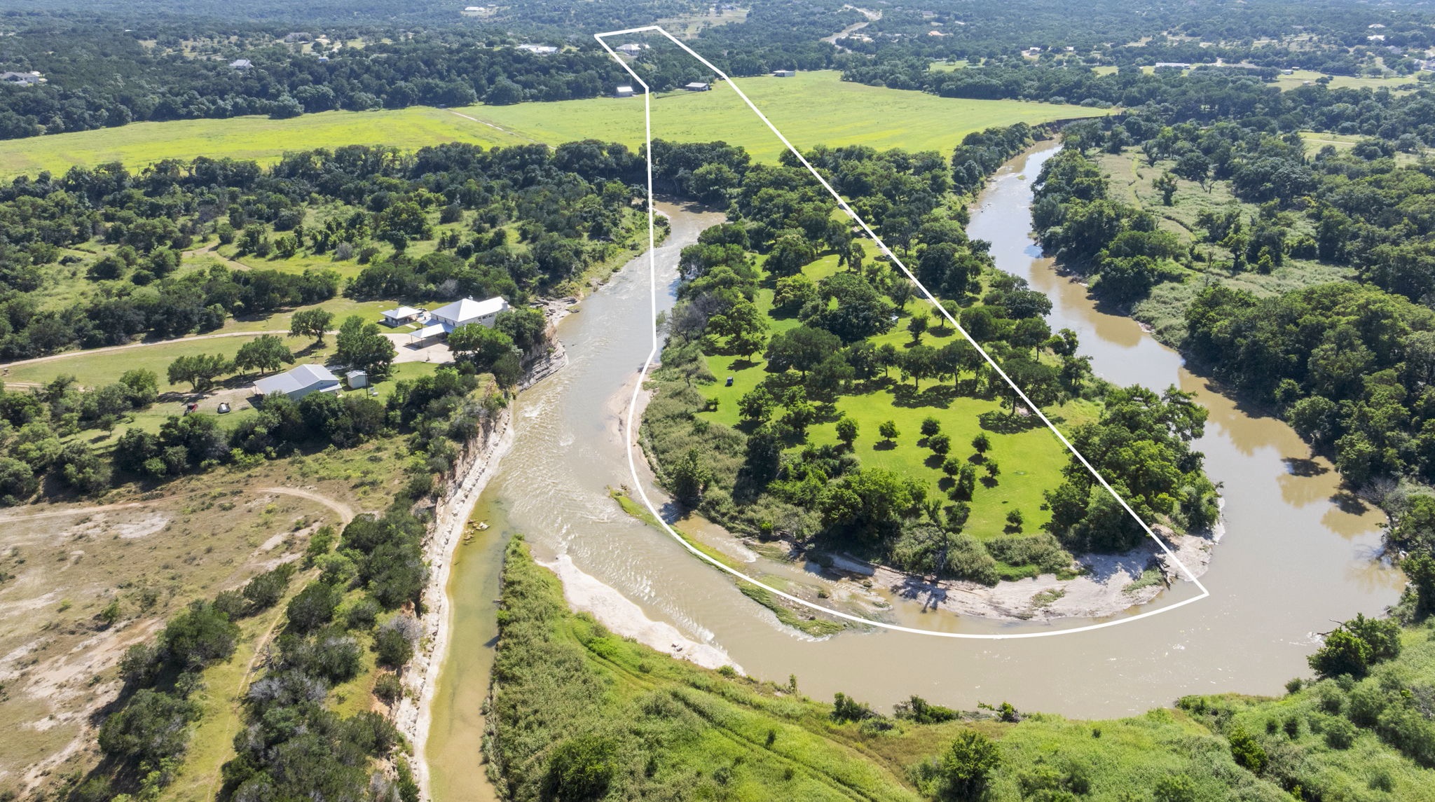 1427 River Ridge Ranch Road Killeen, TX 76549 - Photo 3 of 40 The winding Lampasas river cradles a lush, green landscape, offering serene natural beauty.