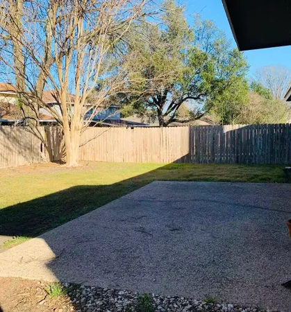 a view of backyard with green space