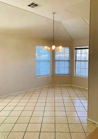 a view of an empty room and window