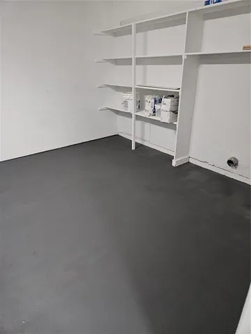 an empty room with shelves