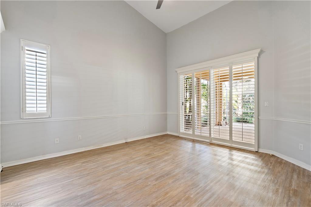 20751 Rivers Ford Estero, FL 33928 - Photo 24 of 36 Empty room featuring light wood finished floors, ceiling fan, and high vaulted ceiling