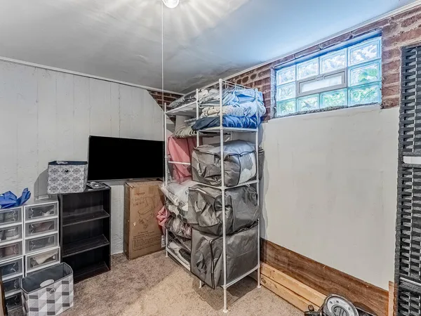 a view of a livingroom with shelves