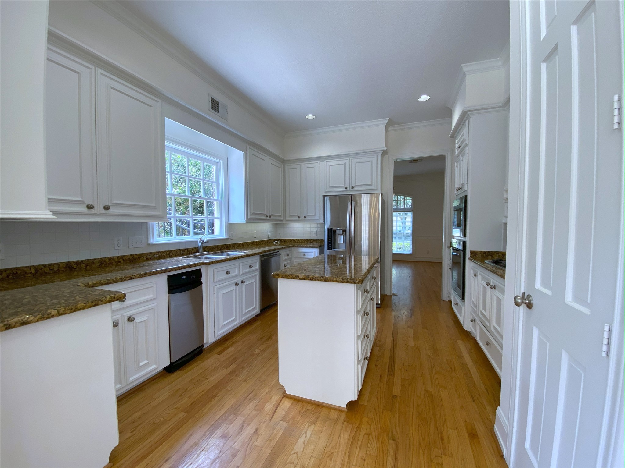 3024 Rice Boulevard Houston, TX 77005 - Photo 6 of 38 Natural light flows into the island kitchen from the above-sink window.