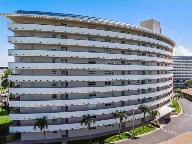 a kitchen with granite countertop a stove top oven microwave and cabinets
