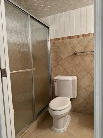 a view of sign board with flower plants