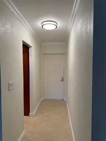 a kitchen with granite countertop wooden cabinets a sink and dishwasher