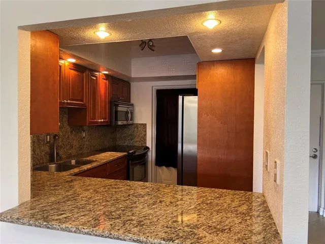 a view of an empty room and a window