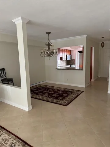 a white toilet sitting next to a shower
