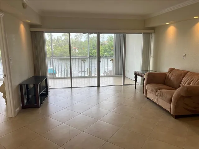 a view of a room with a sink and a mirror
