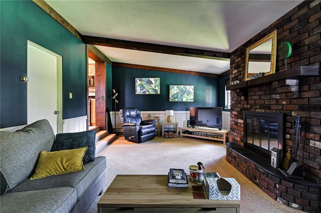 1343 Anderson Road Pittsburgh, PA 15209 - Photo 11 of 20 a living room with furniture and a fireplace