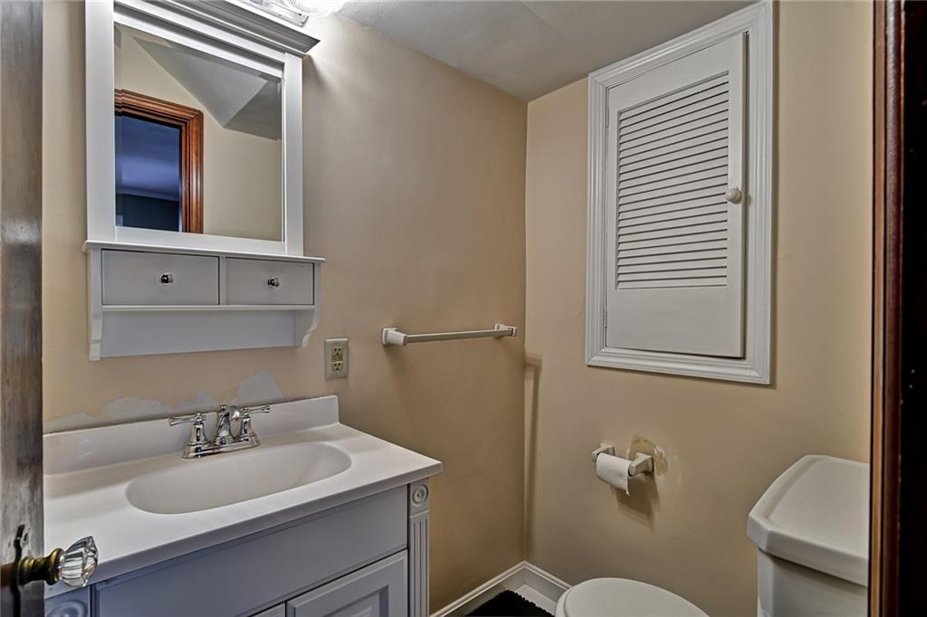 1343 Anderson Road Pittsburgh, PA 15209 - Photo 14 of 20 a bathroom with a sink and a mirror