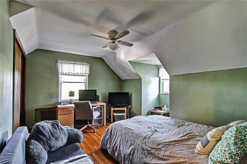 1343 Anderson Road Pittsburgh, PA 15209 - Photo 16 of 20 a bedroom with a bed window and a chair