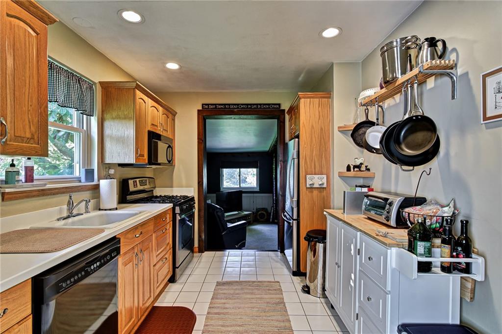 1343 Anderson Road Pittsburgh, PA 15209 - Photo 8 of 20 a kitchen with stainless steel appliances granite countertop a stove and a sink
