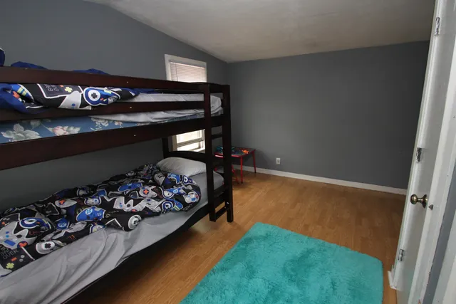 a bed room with a bed and a couch