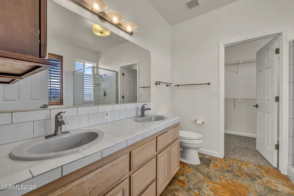 a living room with a bed furniture and a large window
