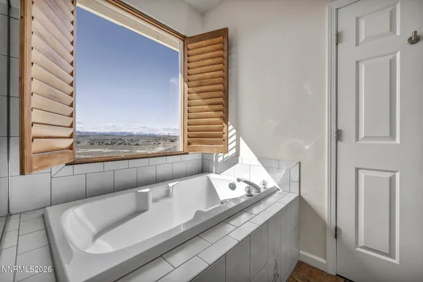 a bathroom with a double vanity sink mirror and toilet