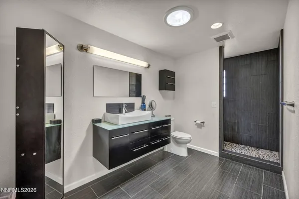 a kitchen with sink stove and cabinets