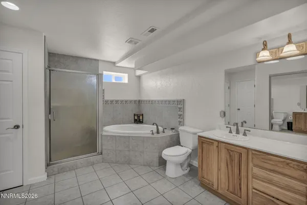 a view of a livingroom with furniture and a flat screen tv