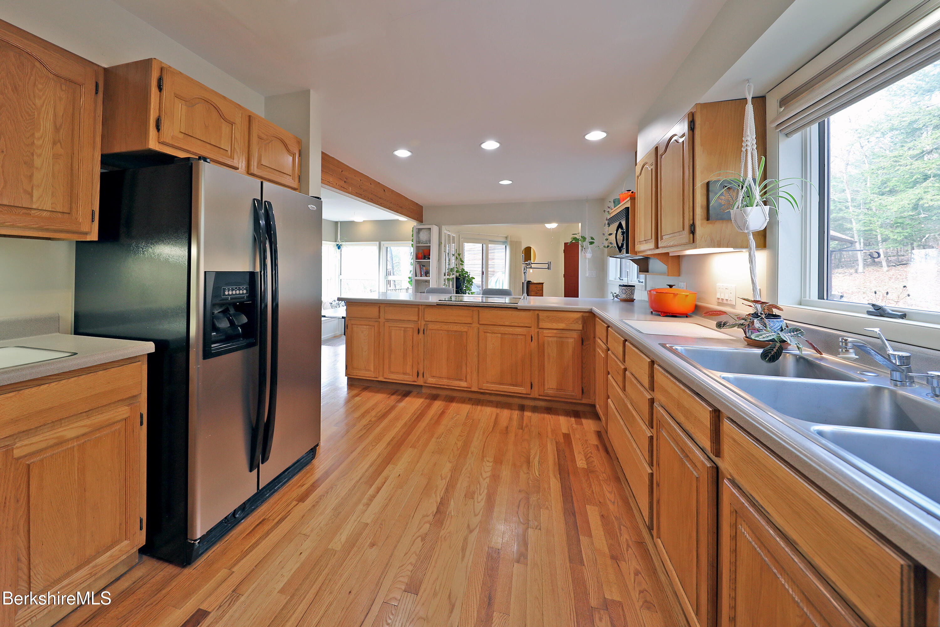 126 Temple Road New Lebanon, NY 12125 - Photo 20 of 70 a kitchen with stainless steel appliances granite countertop a refrigerator a sink dishwasher a stove and white countertops with wooden floor