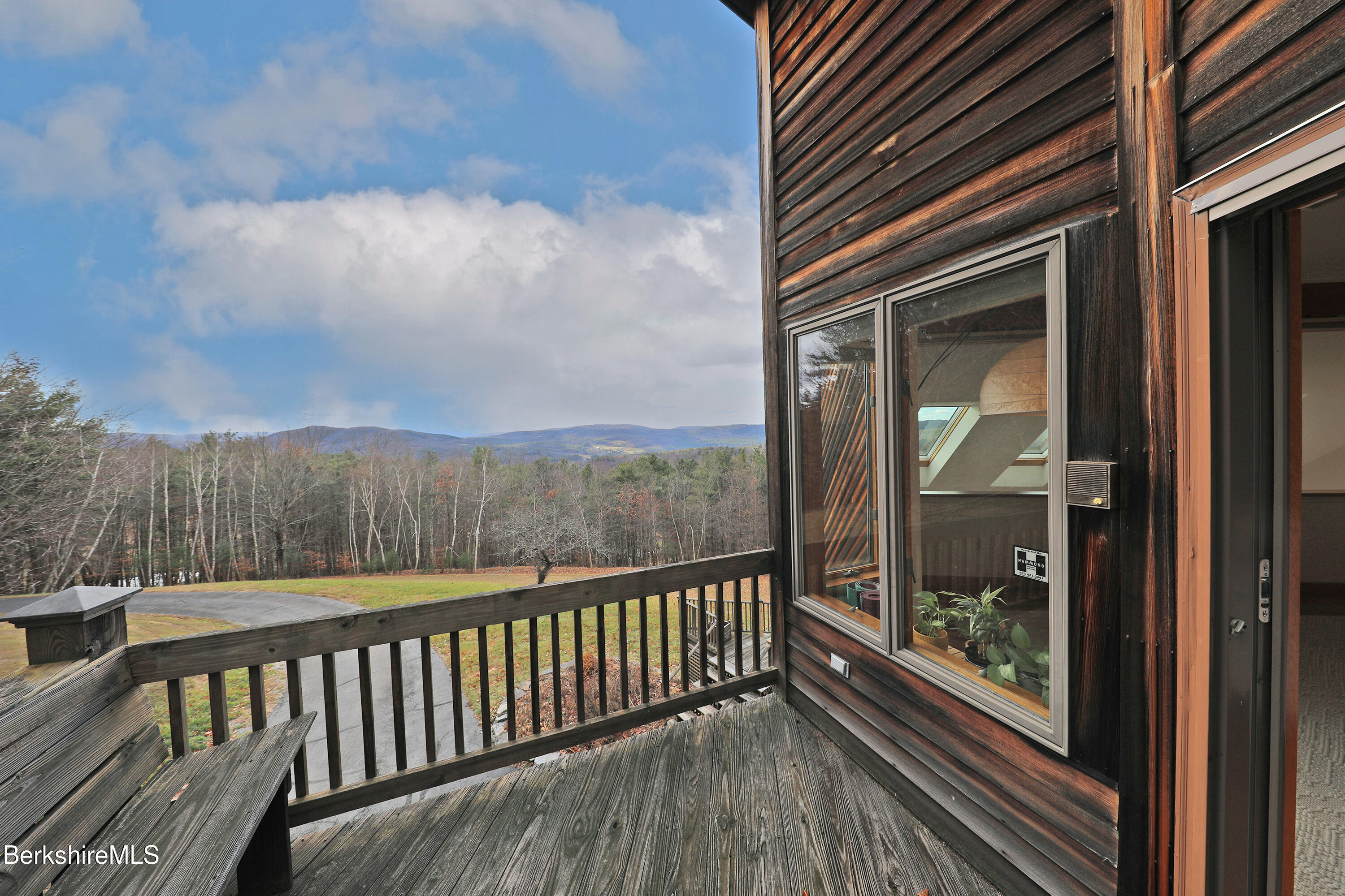 126 Temple Road New Lebanon, NY 12125 - Photo 32 of 70 a view of a balcony with wooden floor and fence