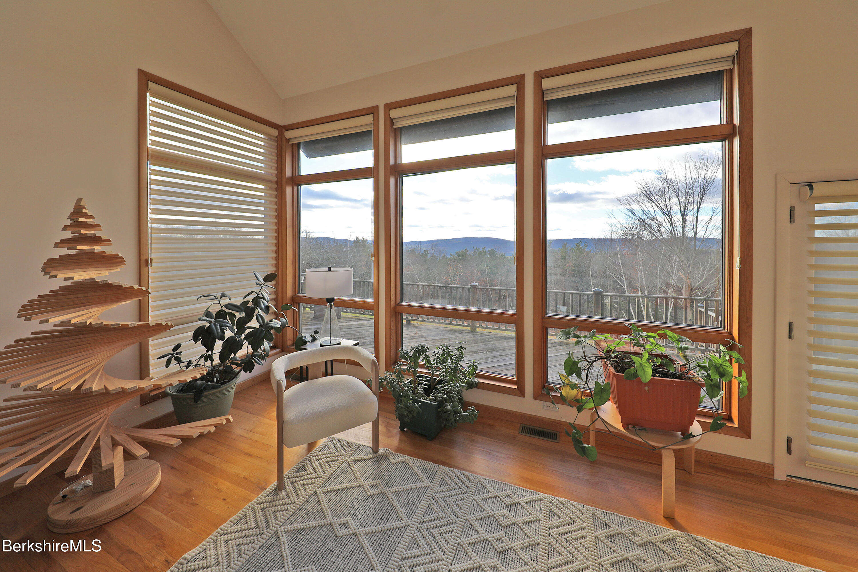 126 Temple Road New Lebanon, NY 12125 - Photo 45 of 70 a room with patio chairs and a large window