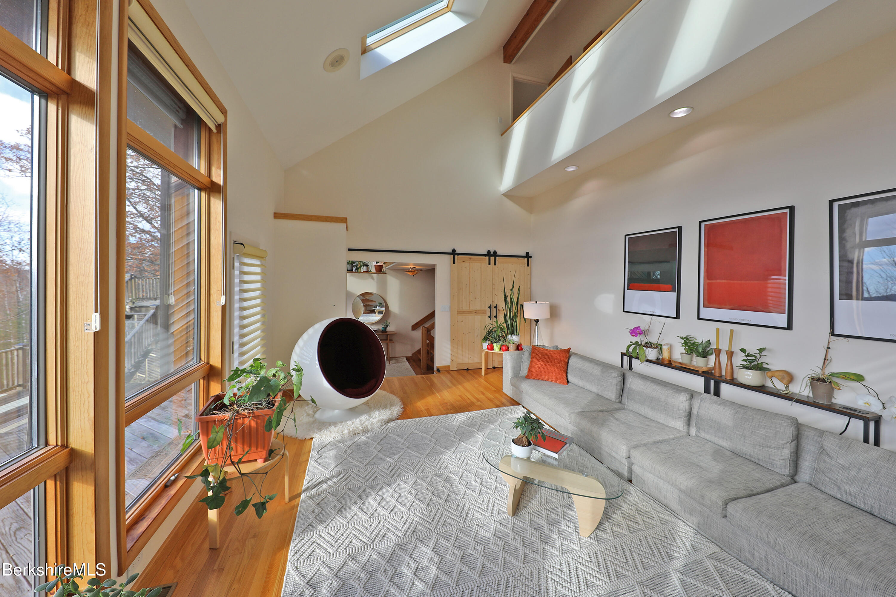 126 Temple Road New Lebanon, NY 12125 - Photo 46 of 70 a living room filled with furniture and a floor to ceiling window