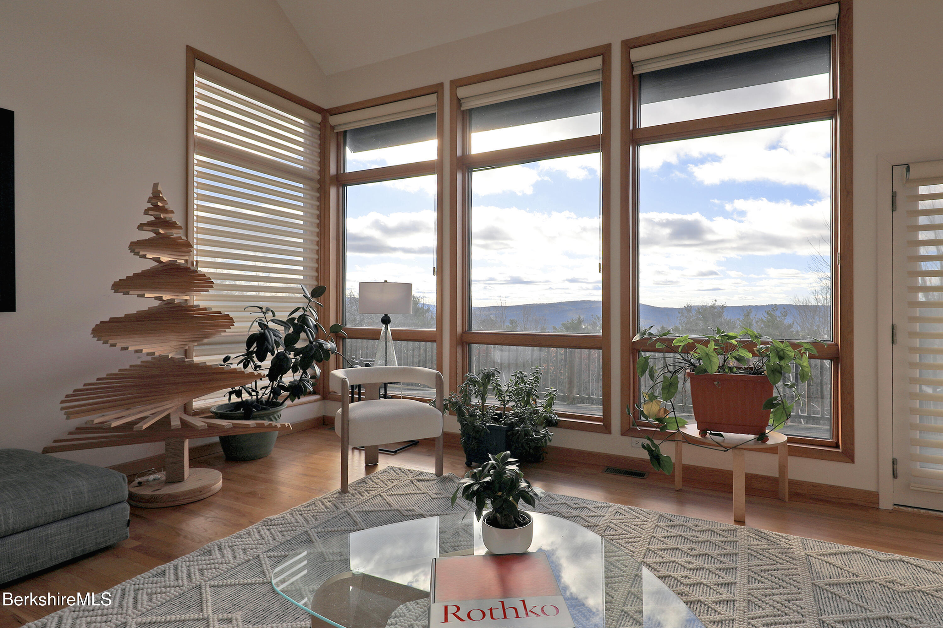 126 Temple Road New Lebanon, NY 12125 - Photo 49 of 70 a living room with patio furniture and floor to ceiling windows