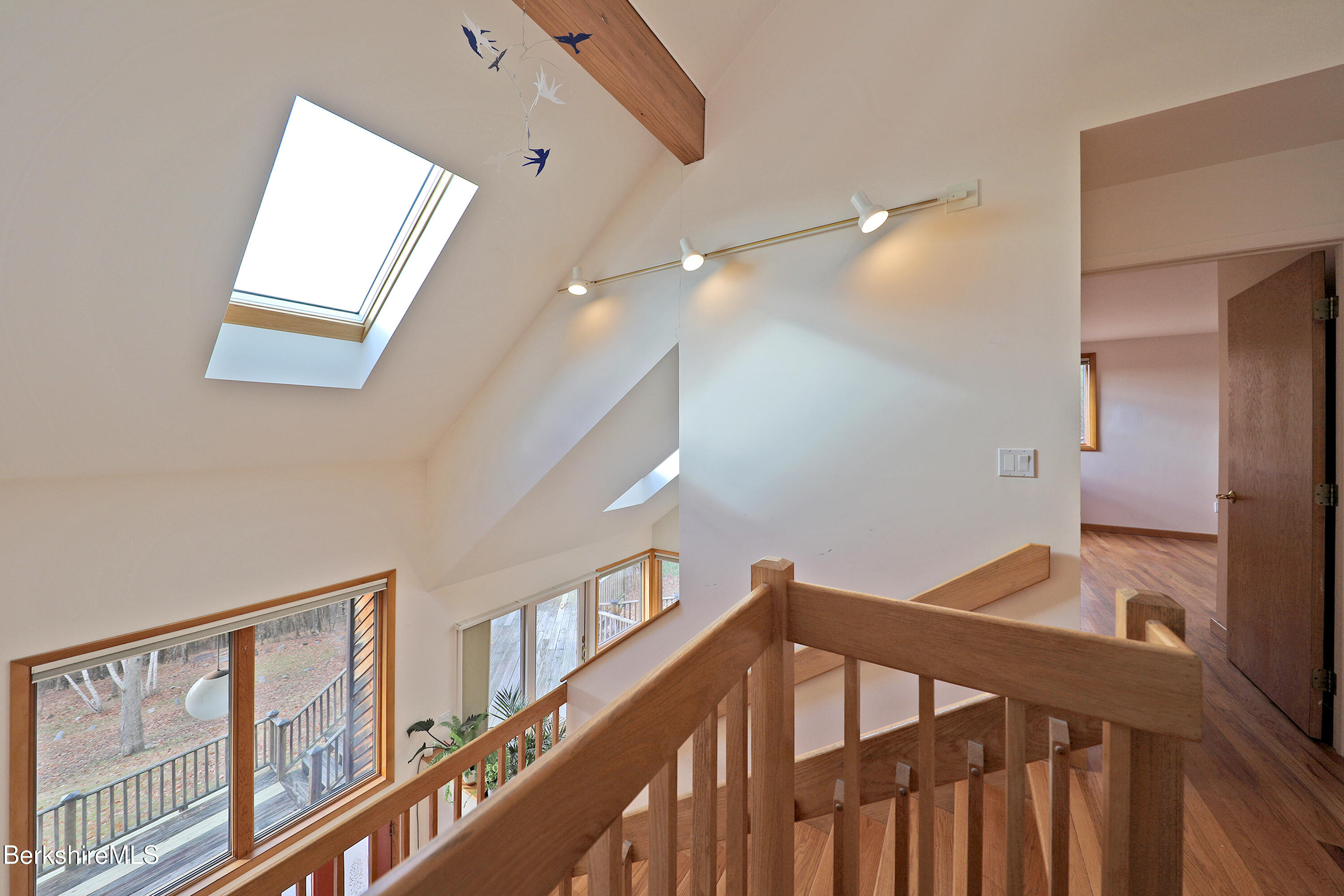 126 Temple Road New Lebanon, NY 12125 - Photo 51 of 70 a view of staircase with lots of frames on wall and wooden floor