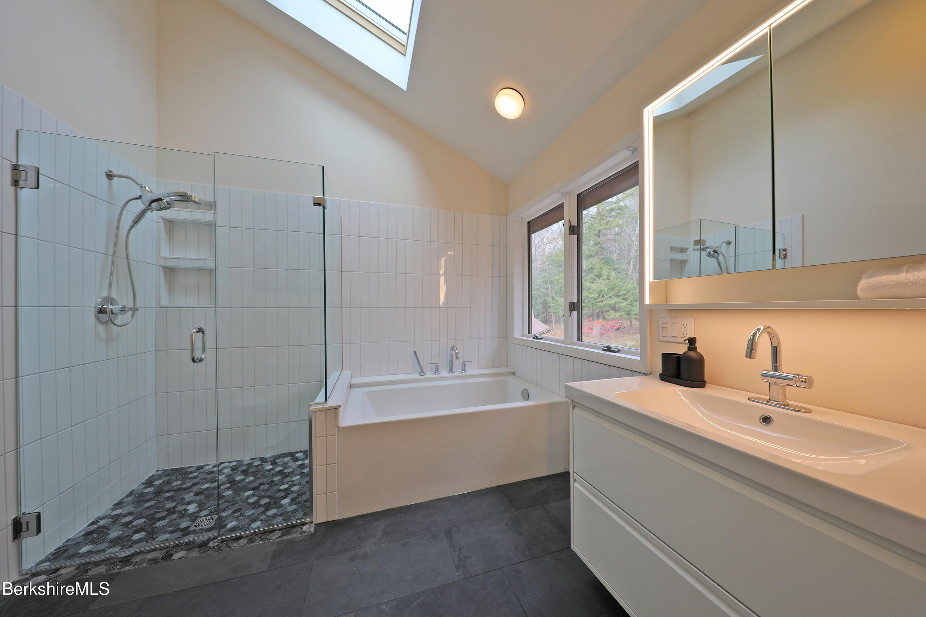 126 Temple Road New Lebanon, NY 12125 - Photo 58 of 70 a bathroom with a tub sink and mirror