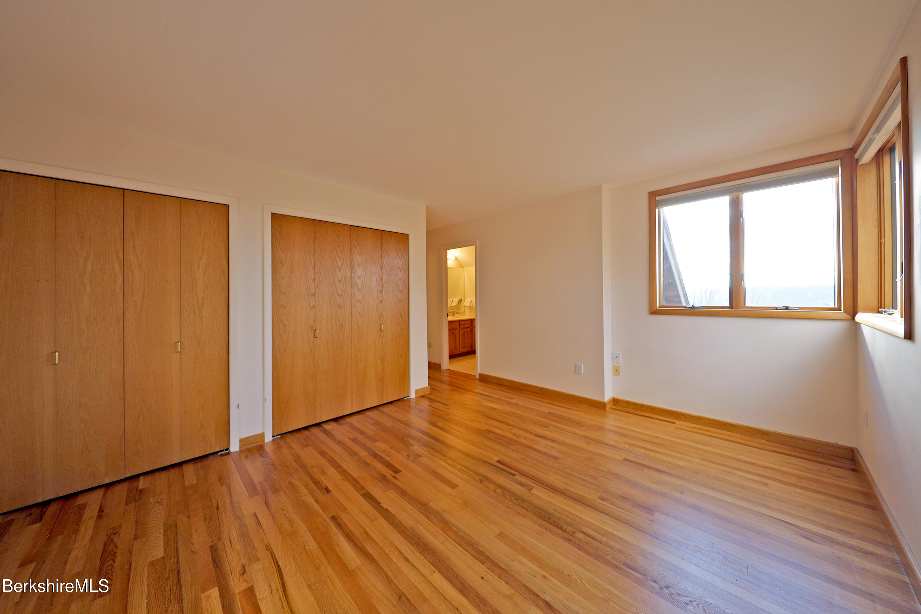 126 Temple Road New Lebanon, NY 12125 - Photo 62 of 70 a view of an empty room with wooden floor and a window