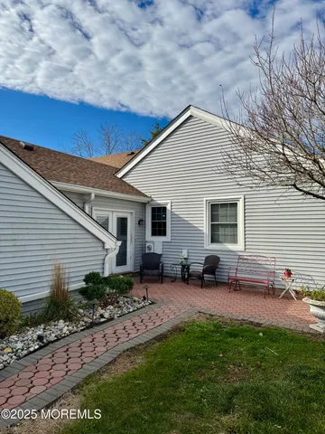 a backyard of a house with seating space