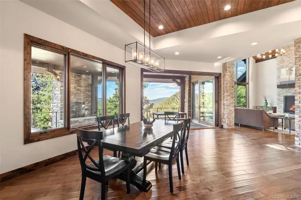 a view of a dining area with furniture and wooden floor