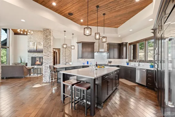 a kitchen with stainless steel appliances a sink stove and cabinets