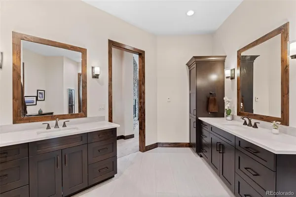 a view of walk in closet with clothes