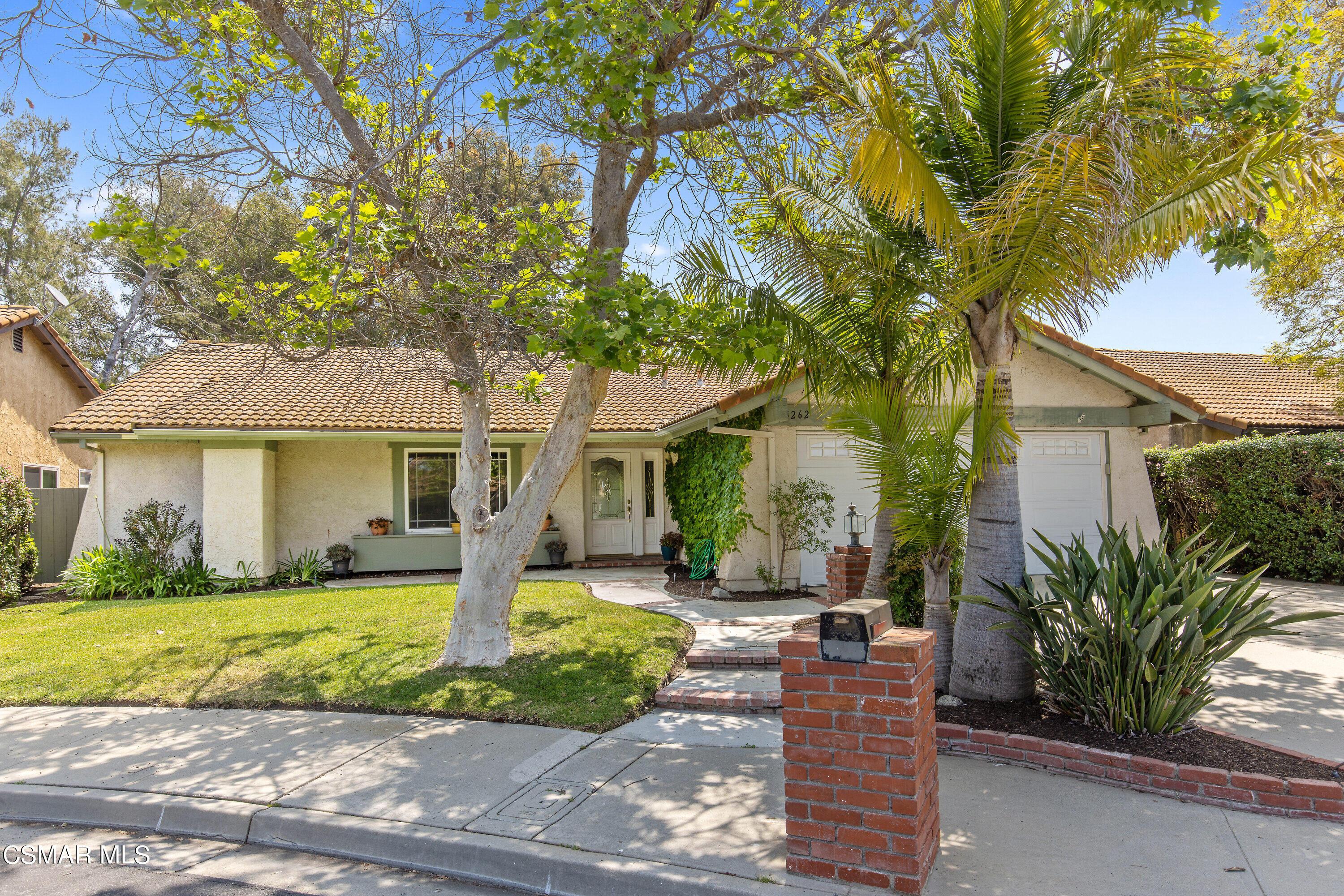 4262 Tecolote Court Moorpark, CA 93021 - Photo 1 of 32 a front view of a house with garden