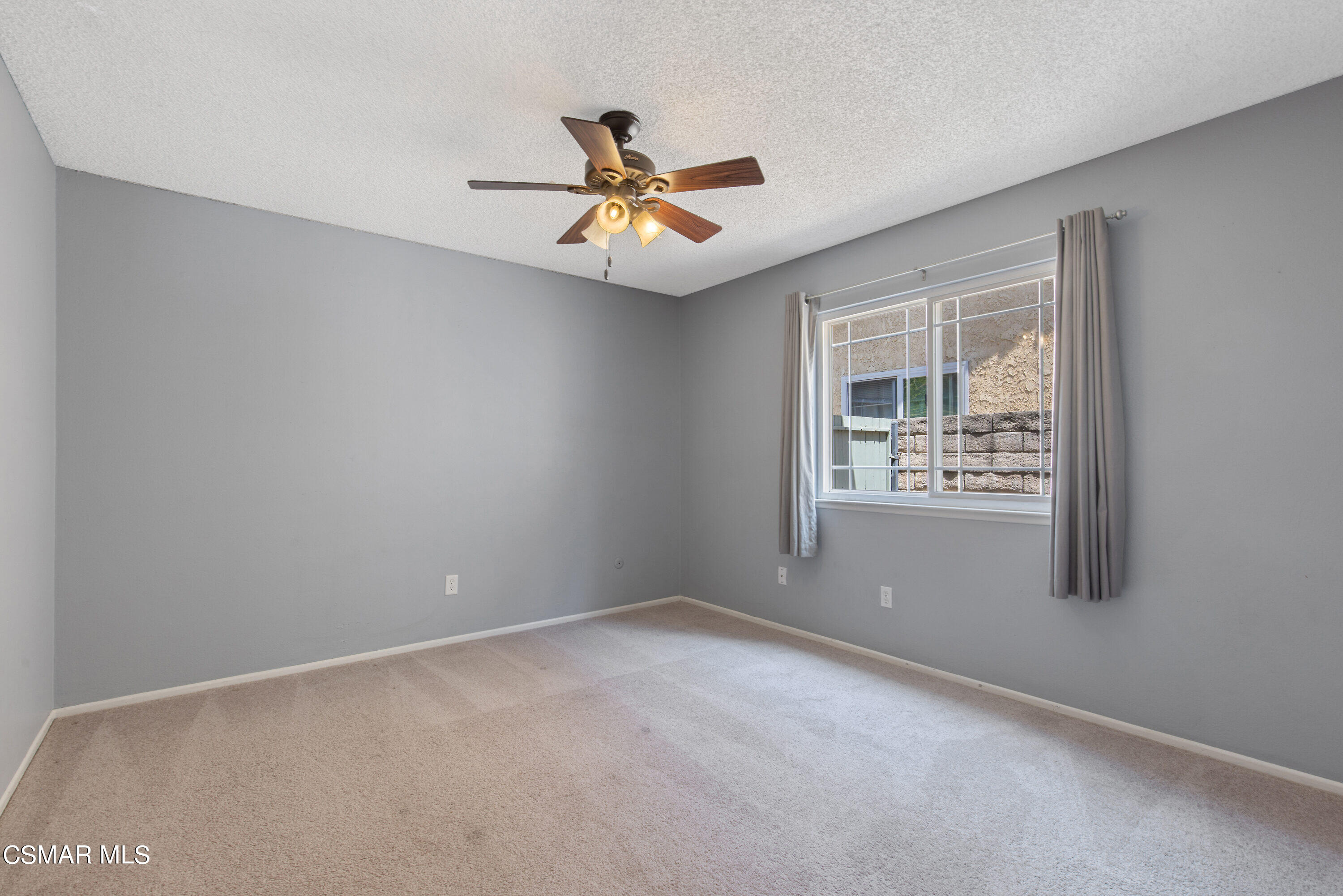 4262 Tecolote Court Moorpark, CA 93021 - Photo 13 of 32 an empty room with windows and fan