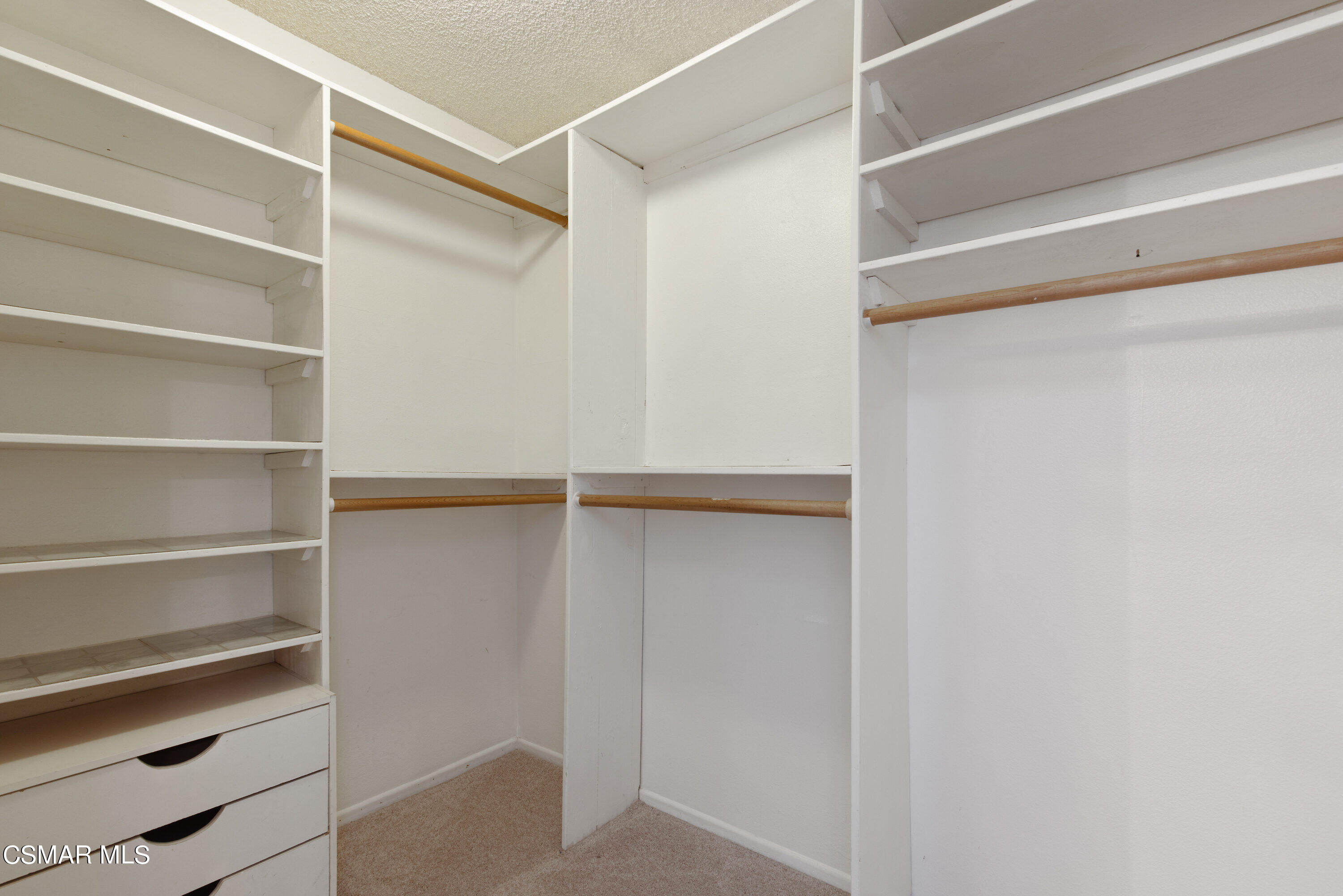 4262 Tecolote Court Moorpark, CA 93021 - Photo 18 of 32 a view of walk in closet with empty racks