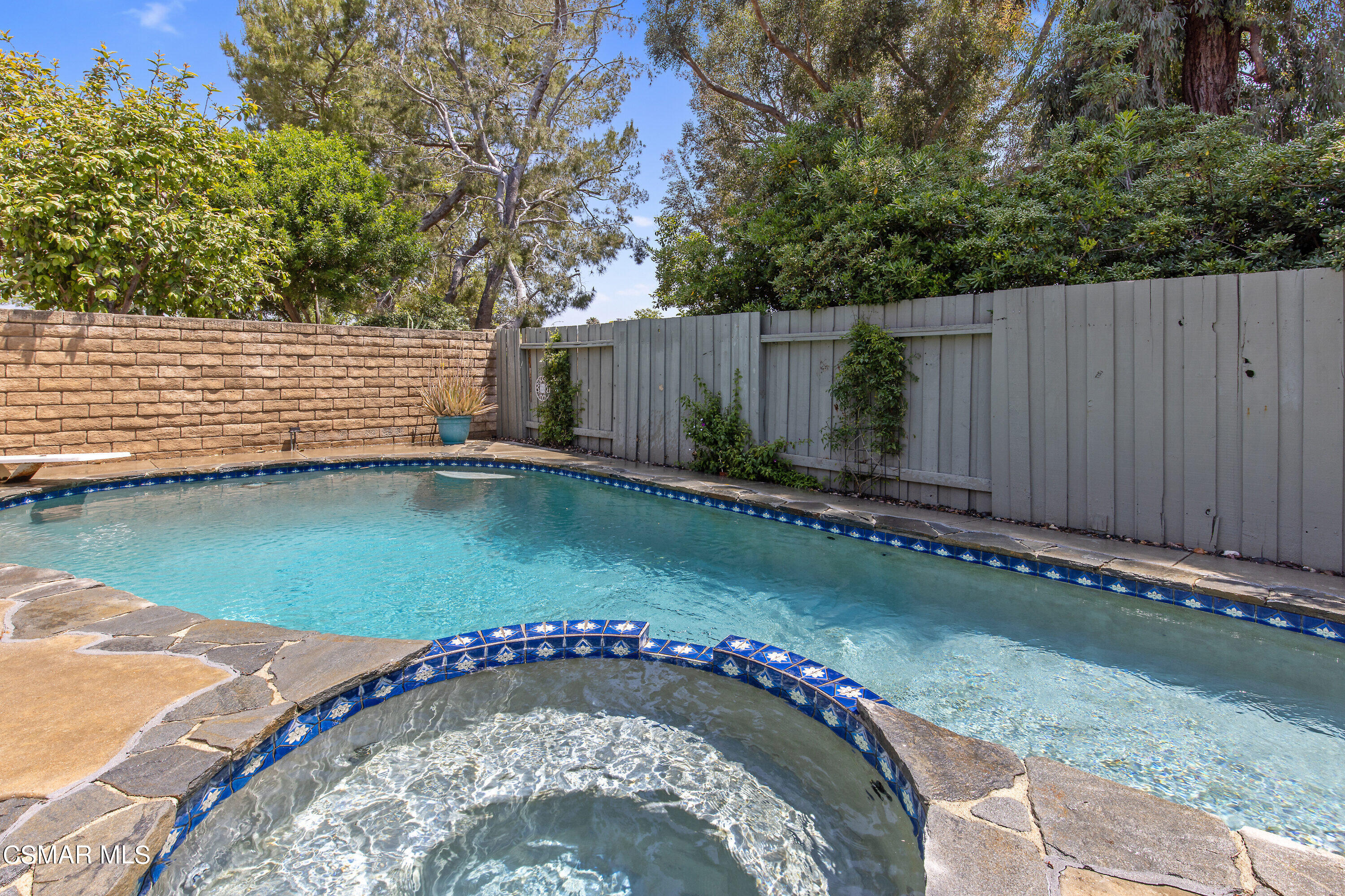 4262 Tecolote Court Moorpark, CA 93021 - Photo 20 of 32 a view of a backyard with swimming pool