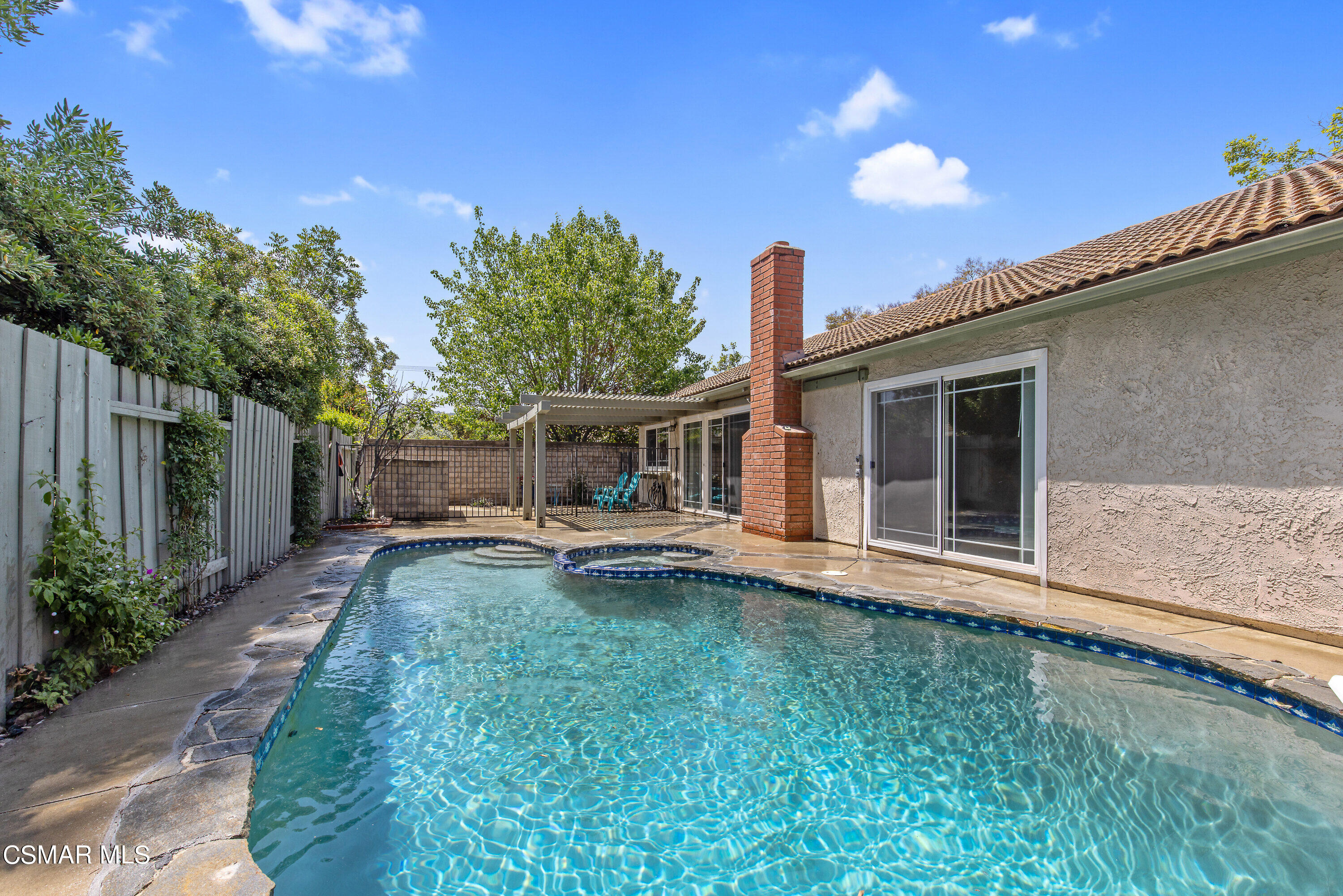 4262 Tecolote Court Moorpark, CA 93021 - Photo 22 of 32 a view of a house with backyard sitting area and garden