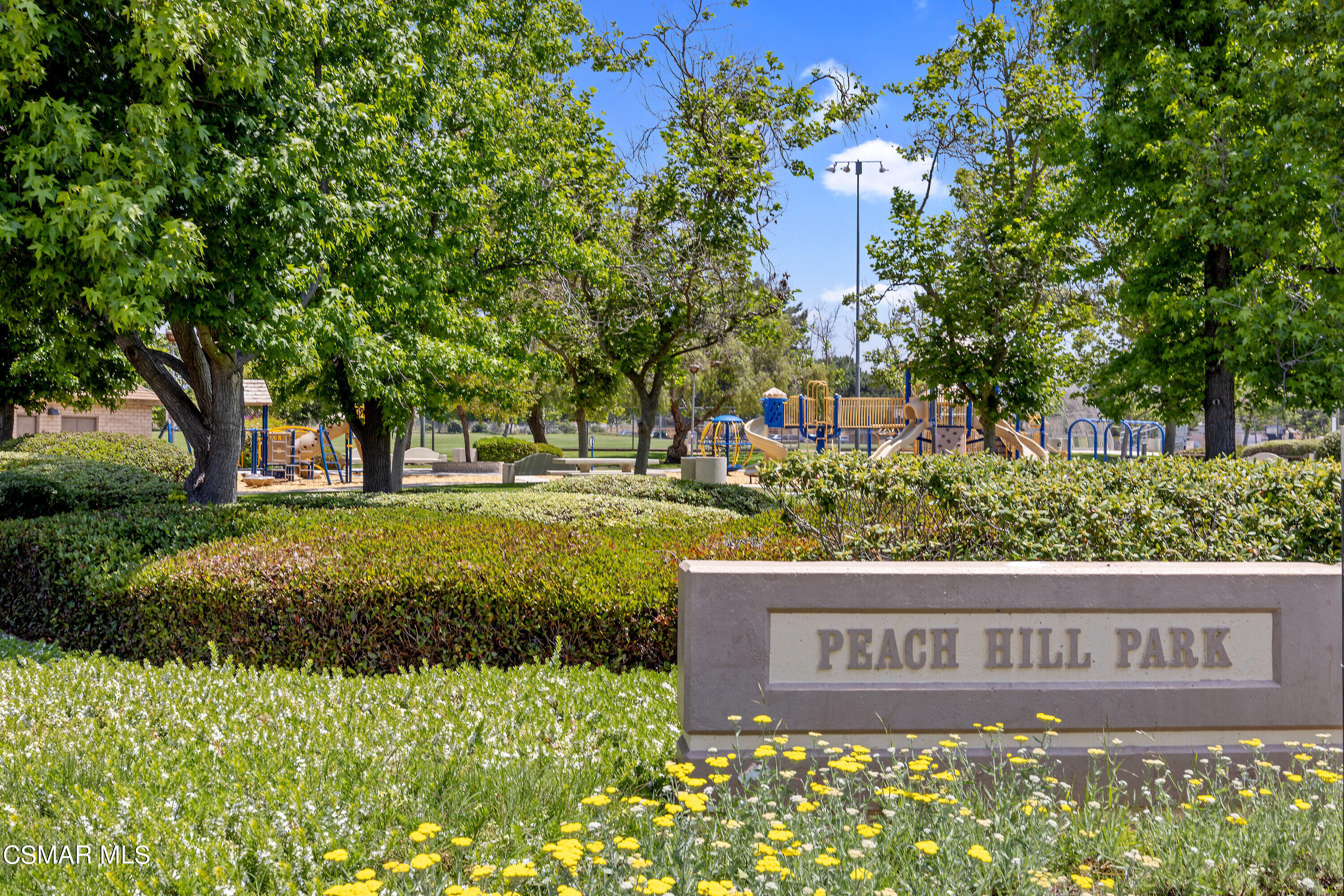 4262 Tecolote Court Moorpark, CA 93021 - Photo 31 of 32 a view of outdoor space with signage and flags