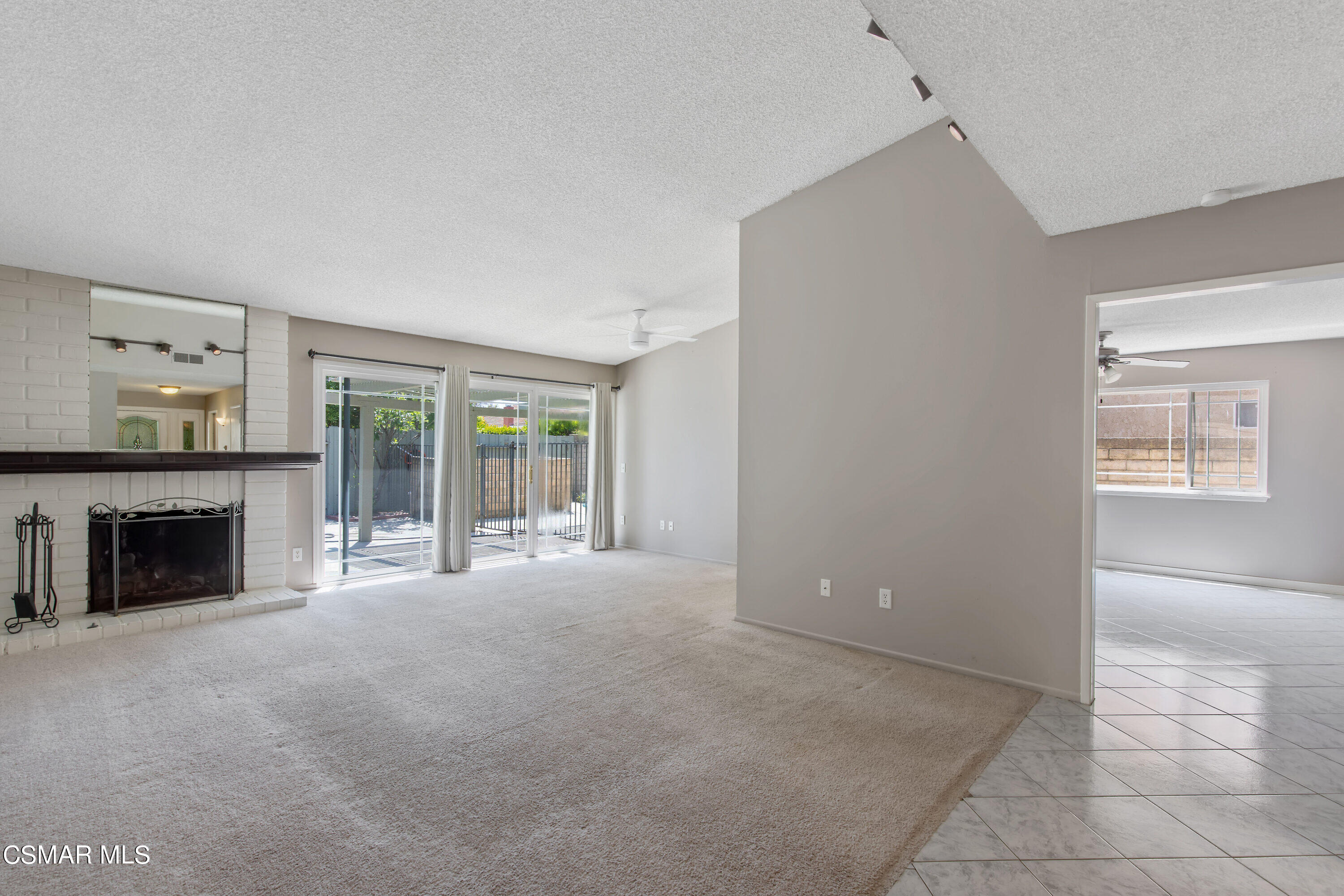 4262 Tecolote Court Moorpark, CA 93021 - Photo 4 of 32 a view of an empty room with a fireplace and a window
