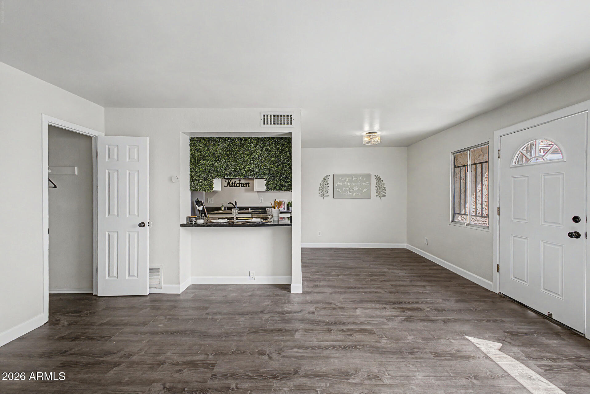 600 South Dobson Road, Unit 177 Mesa, AZ 85202 - Photo 9 of 24 a view of a kitchen from the hallway