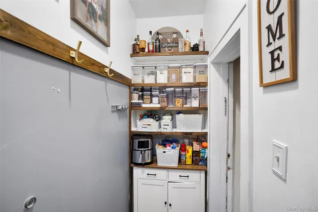 a shelf with books and knick knacks on it