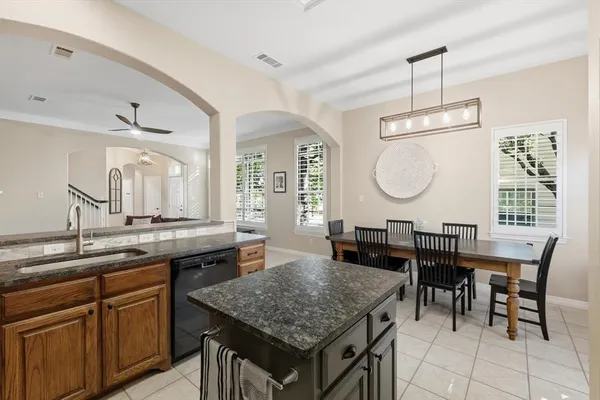 a kitchen with a table and chairs in it