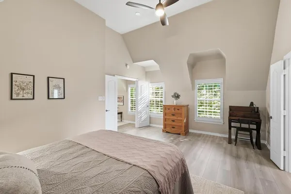 a bedroom with furniture and a window