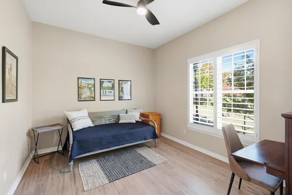 a living room with a couch and a window