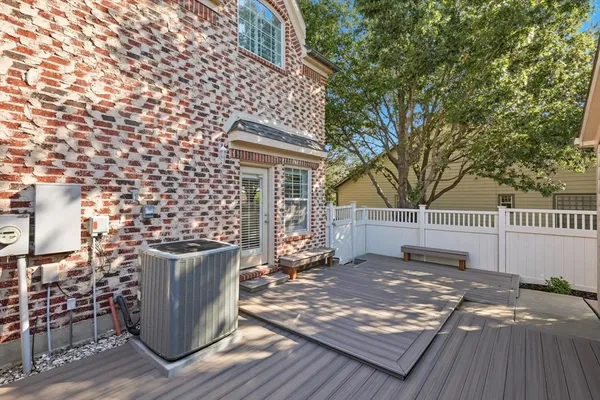 a view of a deck with a wooden fence