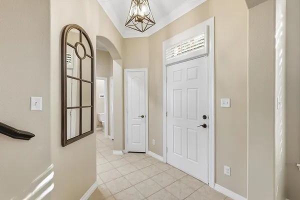 a view of an entryway with a mirror