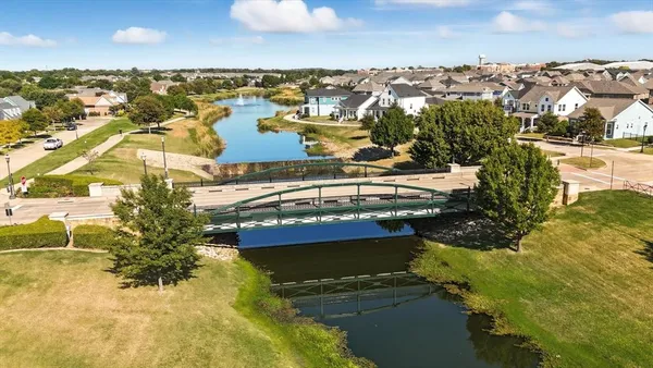 an aerial view of a house with a lake view